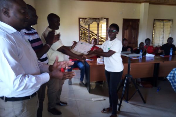 UMI Staff receiving certificate