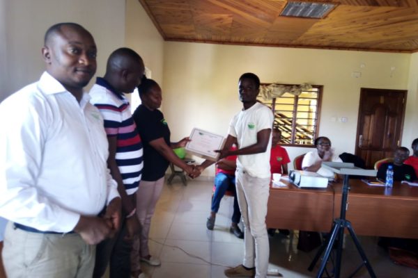 UMI Staff receiving certificate